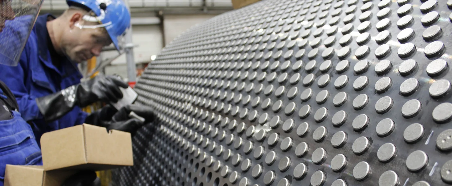 Tungsten carbide studs being installed during an HPGR refurbishment