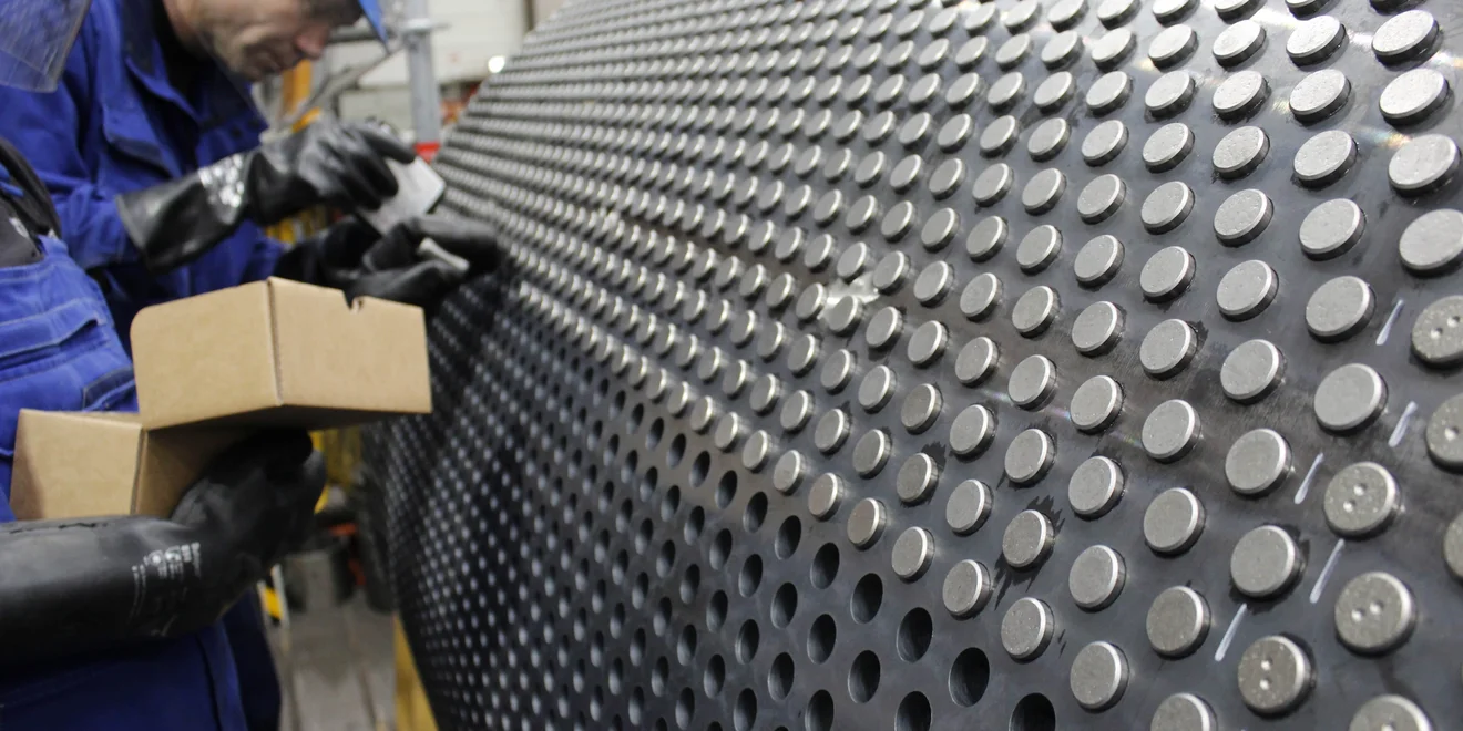 Tungsten carbide studs being installed during an HPGR refurbishment