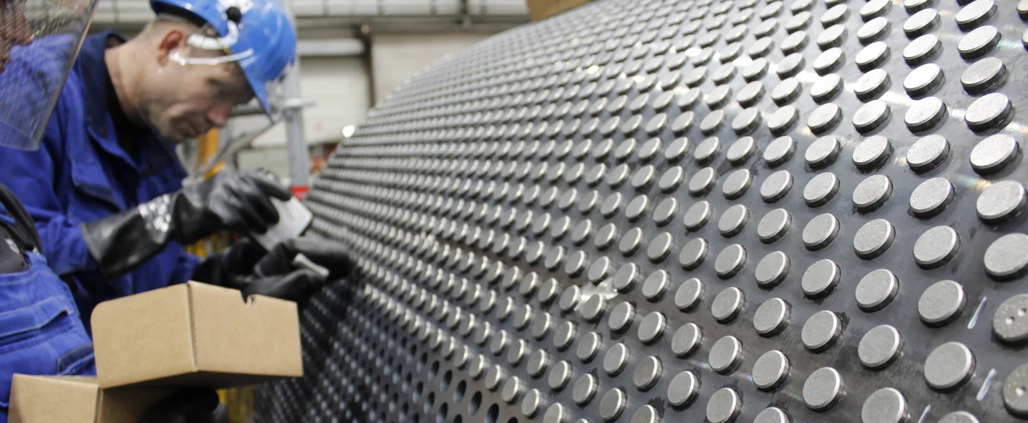 Tungsten carbide studs being installed during an HPGR refurbishment