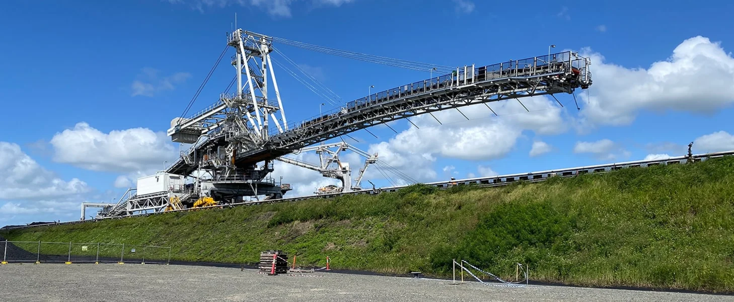 TAKRAF 6,300 t/h Rail-Mounted Stacker for a bulk terminal, Australia. TAKRAF 6,300 t/h Rail-Mounted Stacker for a bulk terminal, Australia.