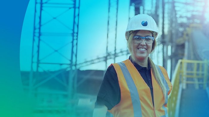 A woman in front of the largest TAKRAF conveyor bridge F60 in Germany.