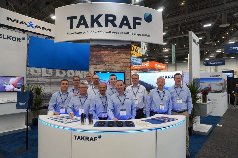 The picture shows the TAKRAF Group team during MINExpo 2024. 