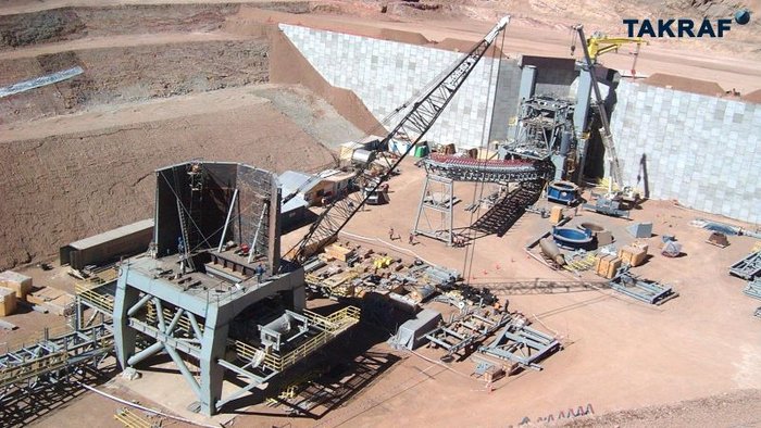 A Chilenian mine with a TAKRAF Crushing Station and a part of a TAKRAF Conveyor.