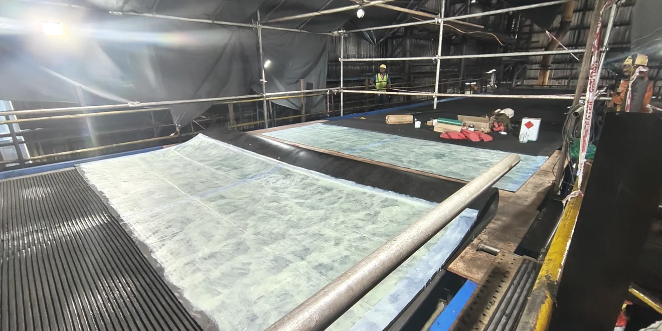 Filter belt splicing in progress.