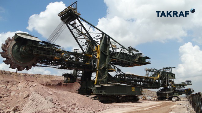 On the picture is a Bucket-Wheel Excavator working in a mine.