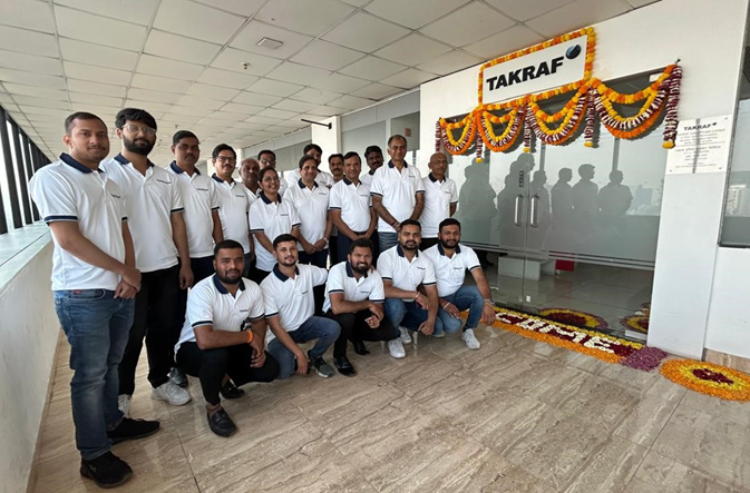 A group of people - the TAKRAF India team in the office in Pune.